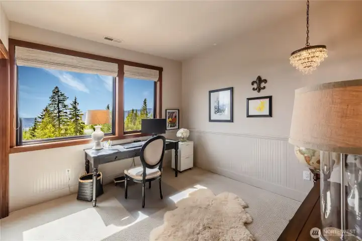 upper floor bedroom is nicely appointed to take in views.