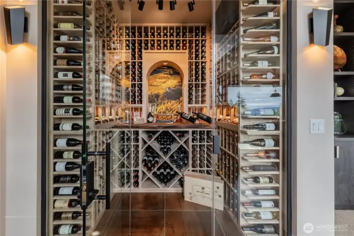 Custom built temp controlled 700+ bottle wine room sets the scene for a perfect evening in with guests or not.