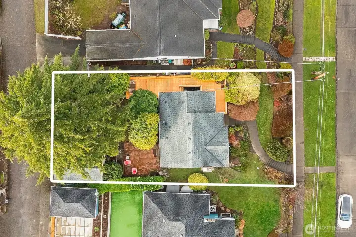 Street to alley lot with convenient garage access and additional parking space behind the garage