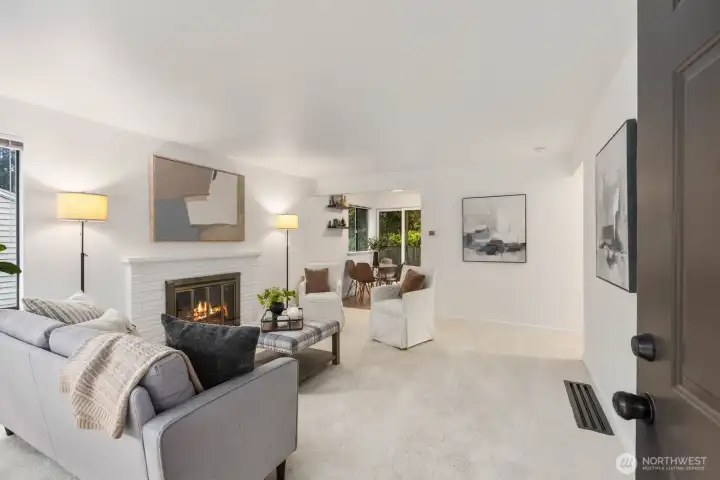 Welcome into the living room with fresh paint and carpet.