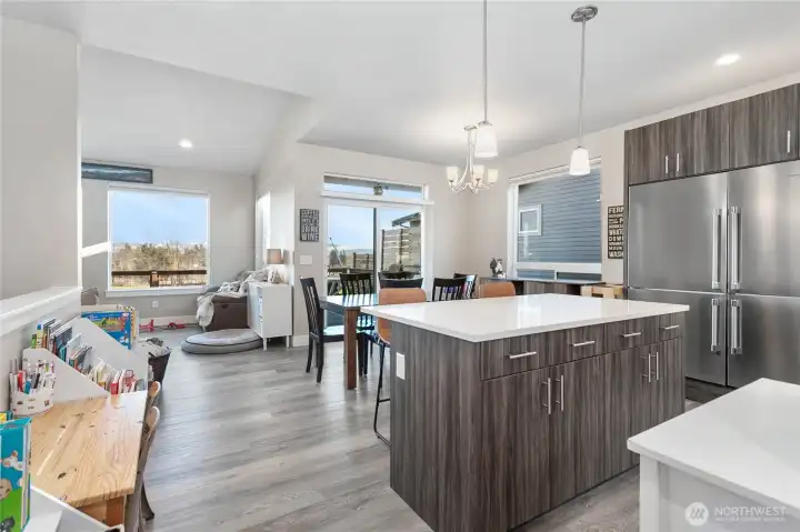 Kitchen looking on to dining and living rooms.