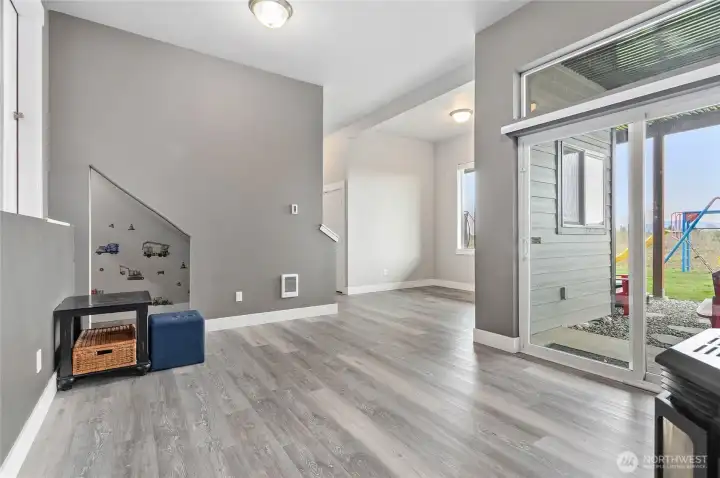 Downstairs living/family room with slider to the backyard