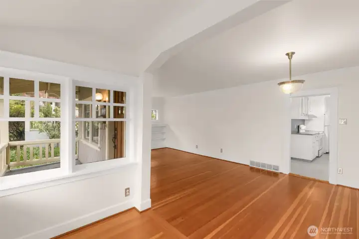 Craftsman details from 1910, which are evident in the beautiful arch and wood floors.