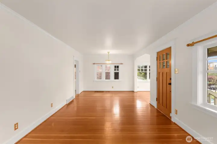 The living and dining rooms and cozy nook area are full of light and opening the windows allows for gentle breezes.