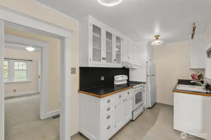 Vintage cabinets and fixtures. Check out this kitchen's beautiful ceiling.
