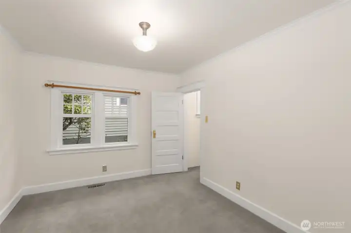 Bedroom has window in walk-in closet, letting in lots of light.