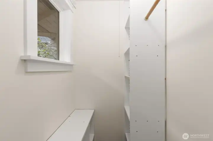 Walk-in closet with window.