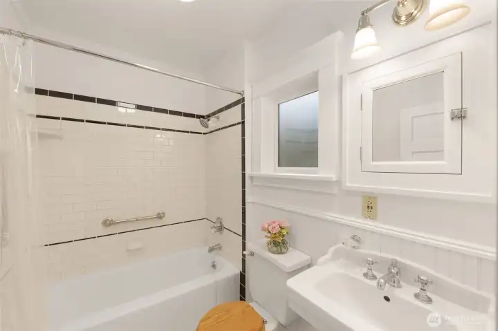 Beautiful ceramic tile and period, craftsman fixtures.