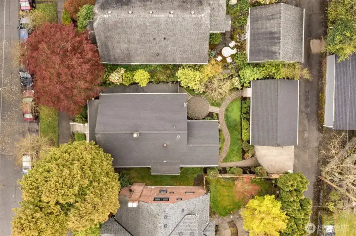 Home has mature landscaping, 1-car garage with Rooster weathervane, generous backyard, solid wood door on the garage and front of the house.