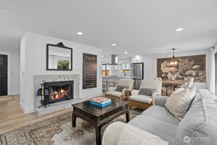 Generous in size and flooded with light, the living room flows effortlessly into the dining area.