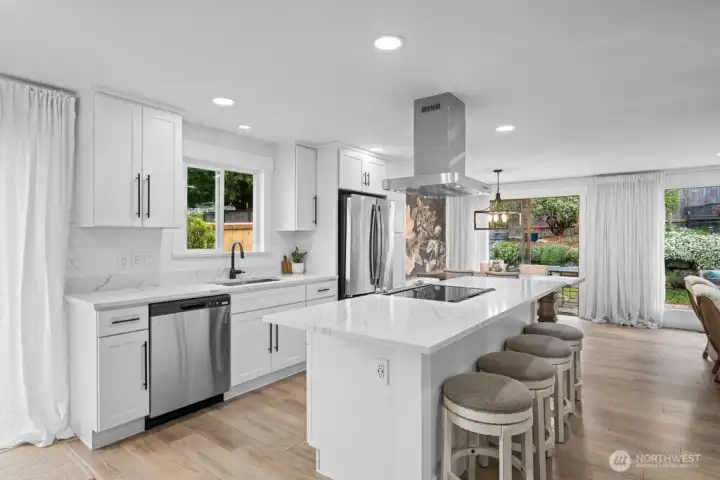 The heart of the home. Quartz countertops throughout and an island with seating for six.