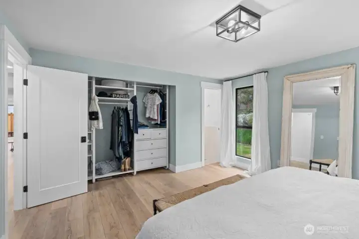 A thoughtfully designed custom closet system makes this suite as functional as it is restful.