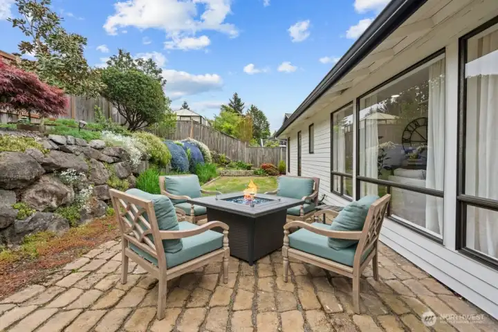 Gather around the firepit as the evening settles in. The kind of backyard you never want to leave.