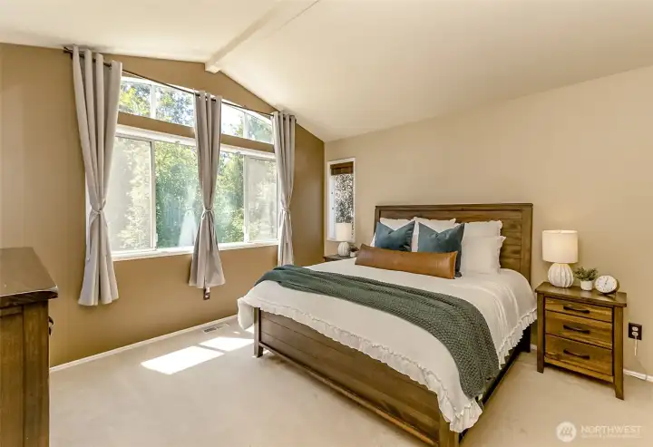 This Large Primary bedroom features soaring ceilings, lots of natural light, a walk-in closet and a 5-piece primary bath.