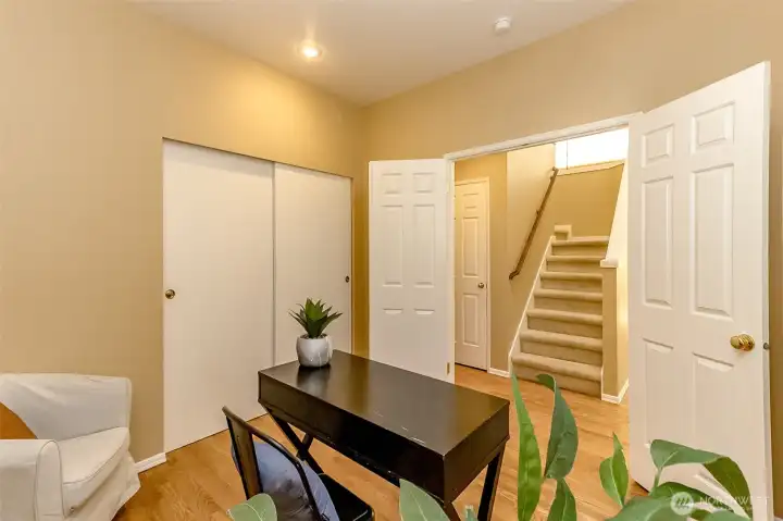 Here's the bedroom on the main floor, featuring French doors. This room is great for multigeneration living, or a private home office or den.