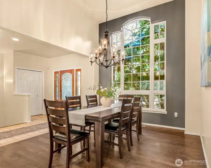 Beautiful High Ceilings and warm hardwood floors in the dining room
