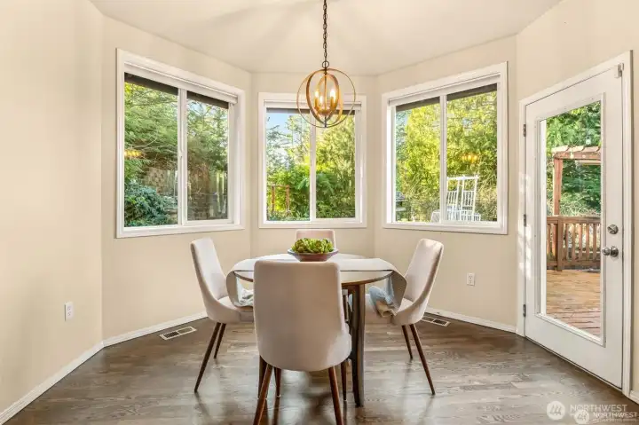 Bright and inviting kitchen nook conveniently located between the kitchen and family room