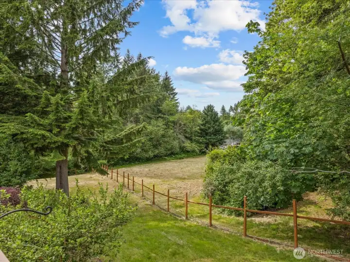 Newer fencing surrounds the property, providing added privacy, security, and plenty of space for pets and animals to roam safely.