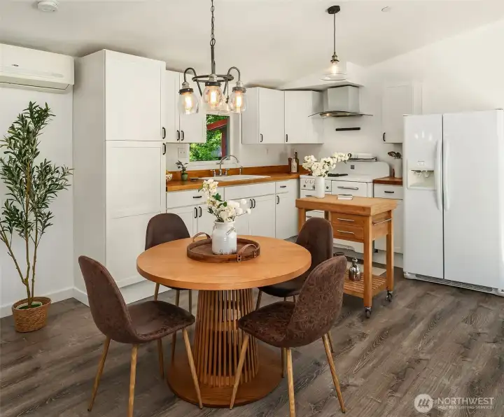 Vinyl plank flooring, vaulted ceilings, and floor to ceiling sliding doors are just a few of the appealing amenities about this home.