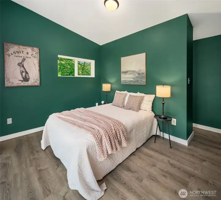 The second bedroom sits on the east end of the home and features a walk-in closet.