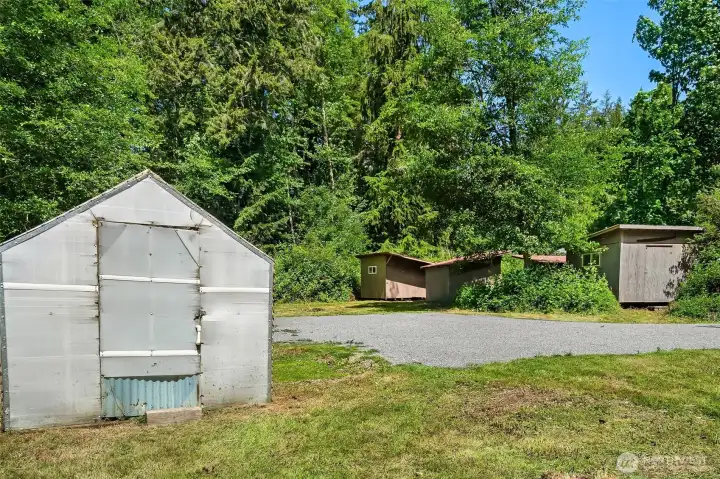 The greenhouse is waiting on your green thumb! Several well-constructed sheds are ready for your gardening supplies, bikes, tools ...