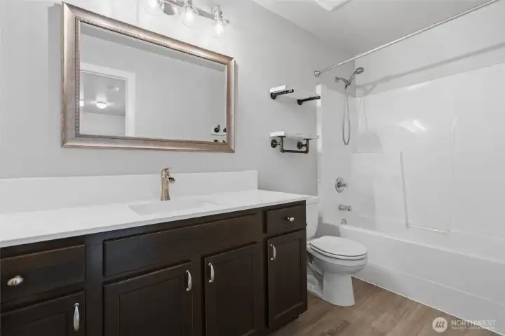 Guest bathroom, with tub and shower.