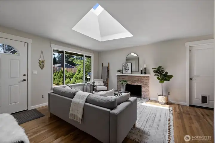 Ample light coming from overhead skylights and huge picture window
