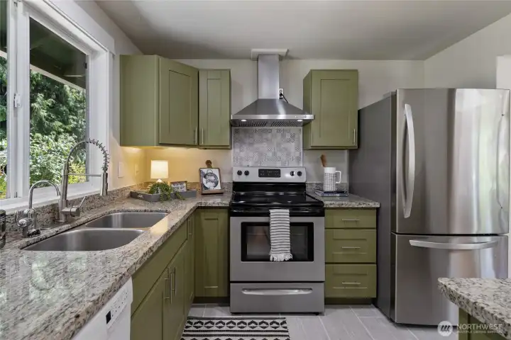 Kitchen equipped with overhead stove vent
