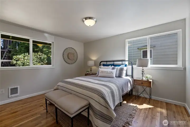 Primary bedroom with attached bathroom and walk in closet