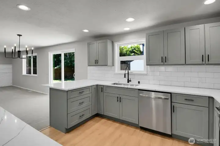 The kitchen overlooks the great room and formal front room/dining area The kitchen overlooks the great room and formal front room/dining area