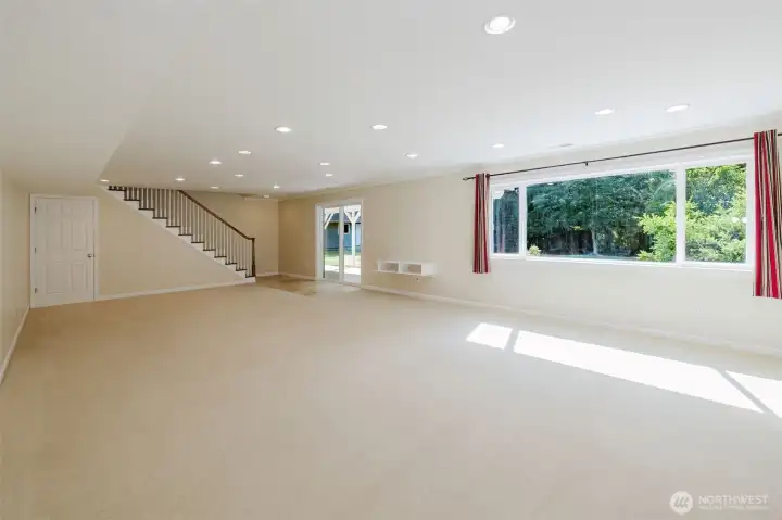 Enter the daylight basement into large recreation room or family room. Enter the daylight basement into large recreation room or family room.
