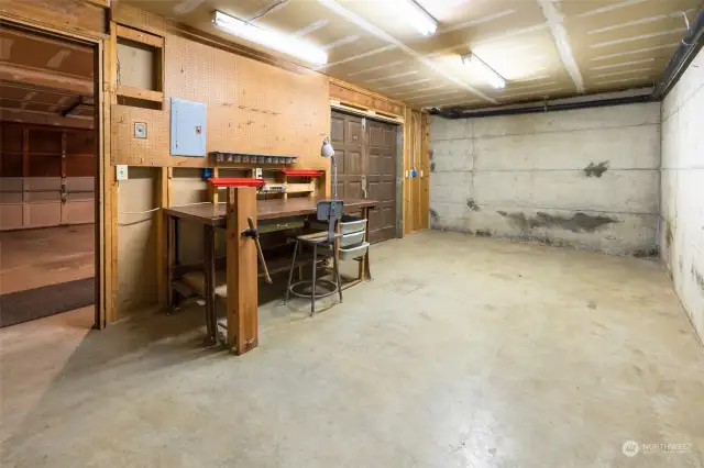 Workshop area inside and behind 2 car garage garage