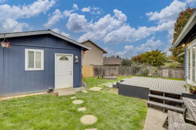 looking from side yard in back is the 12x12 "studio" that has power, heat & A/C.