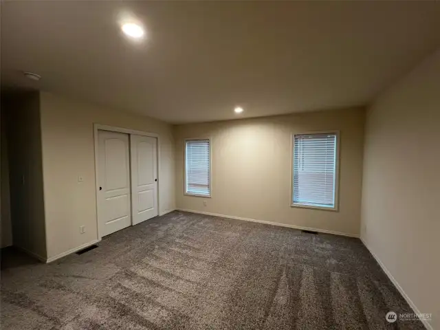 Primary bedroom with walk-in closet