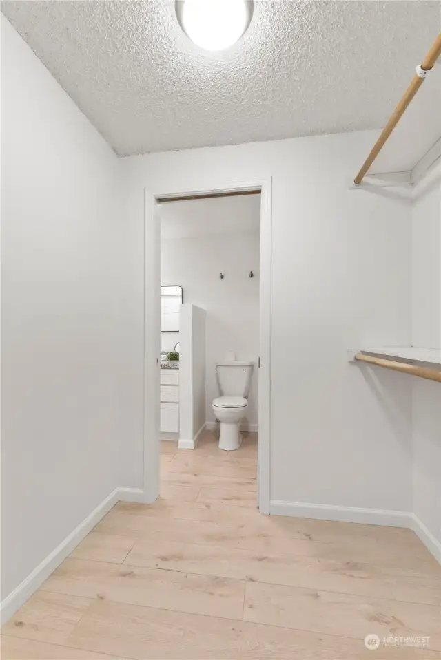 Large walk-through closet to the bathroom.