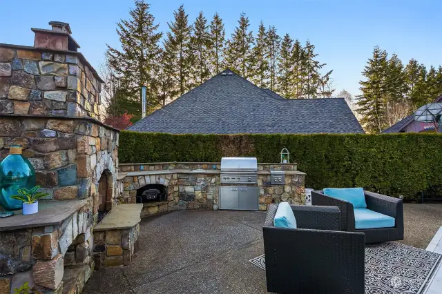 Outdoor Kitchen with BBQ, 2 additional gas Burners, sink, and a wood burning Fireplace~