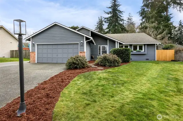 Sunny setting on quiet street w/ fully fenced yard