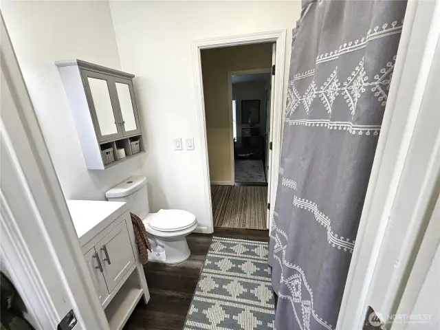 Main bath with 2 doors from hall to hall.