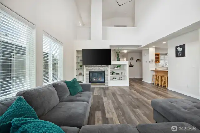 Gas fireplace, built in shelving, and plenty of natural light!