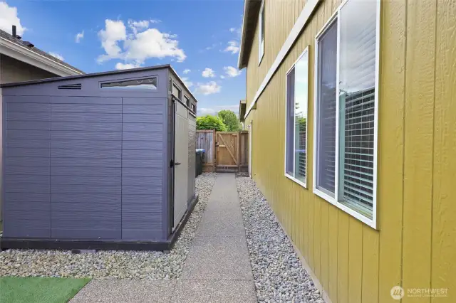 Large shed stays with the home! Gate to front yard for easy access.