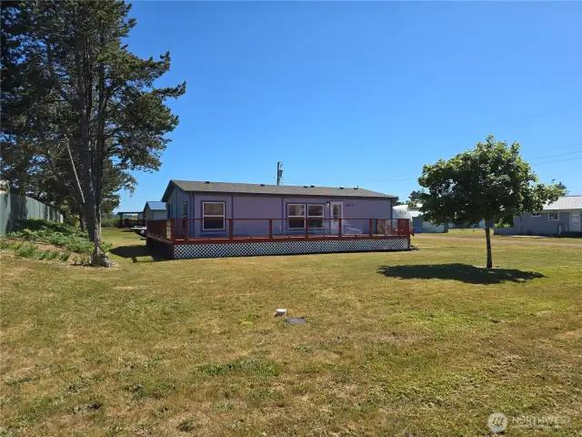 Front of home with large wrap around deck