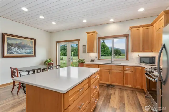 Soft close drawers, quartz countertops, undercabinet lights, island for bar seating and plenty of natural light.