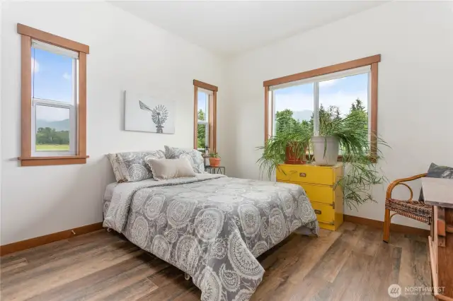 Thoughtfully designed with a split-bedroom layout, the primary suite is tucked away on one side of the home, while the secondary bedrooms and bath are situated on the other—offering comfort and privacy for everyone.