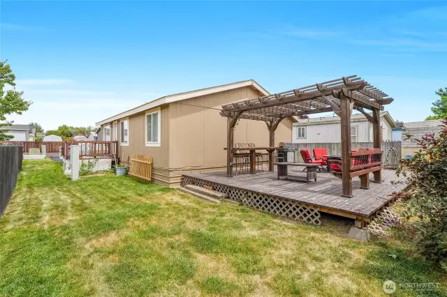 Speaking of shade, check out this large deck in back with a heavy-duty gazebo for shade!