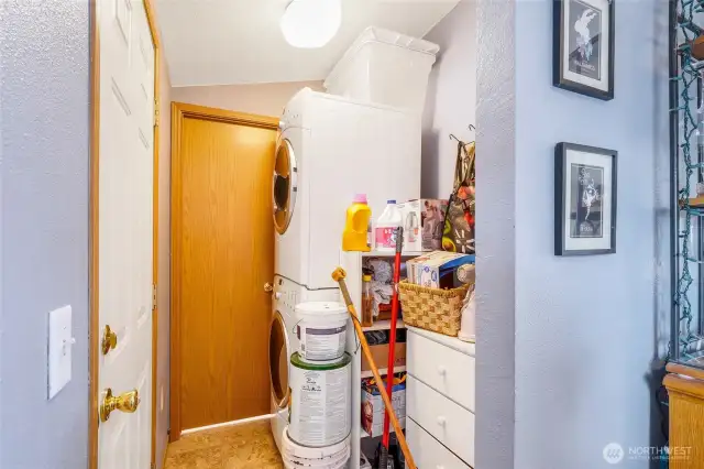 The laundry room is tucked in between the kitchen and half bathroom.