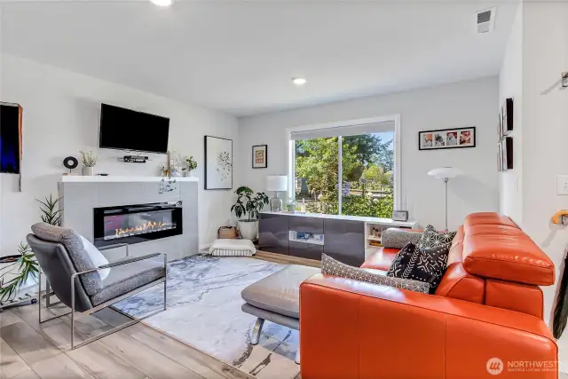 Electric fireplace and view of Long Lake from living room