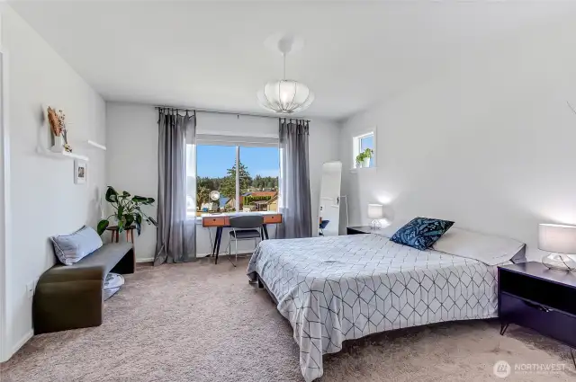 Primary Bedroom upstairs with view of Long Lake