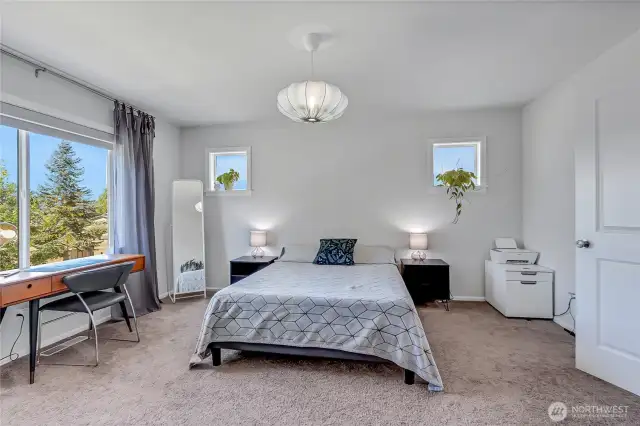 Primary bedroom with walk in closet off private bath.