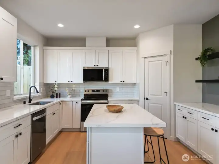 Chef's kitchen has walk in pantry in addition to so much cabinet space.