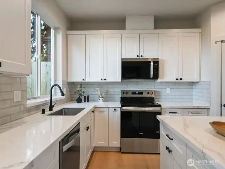 Kitchen has stainless appliances.